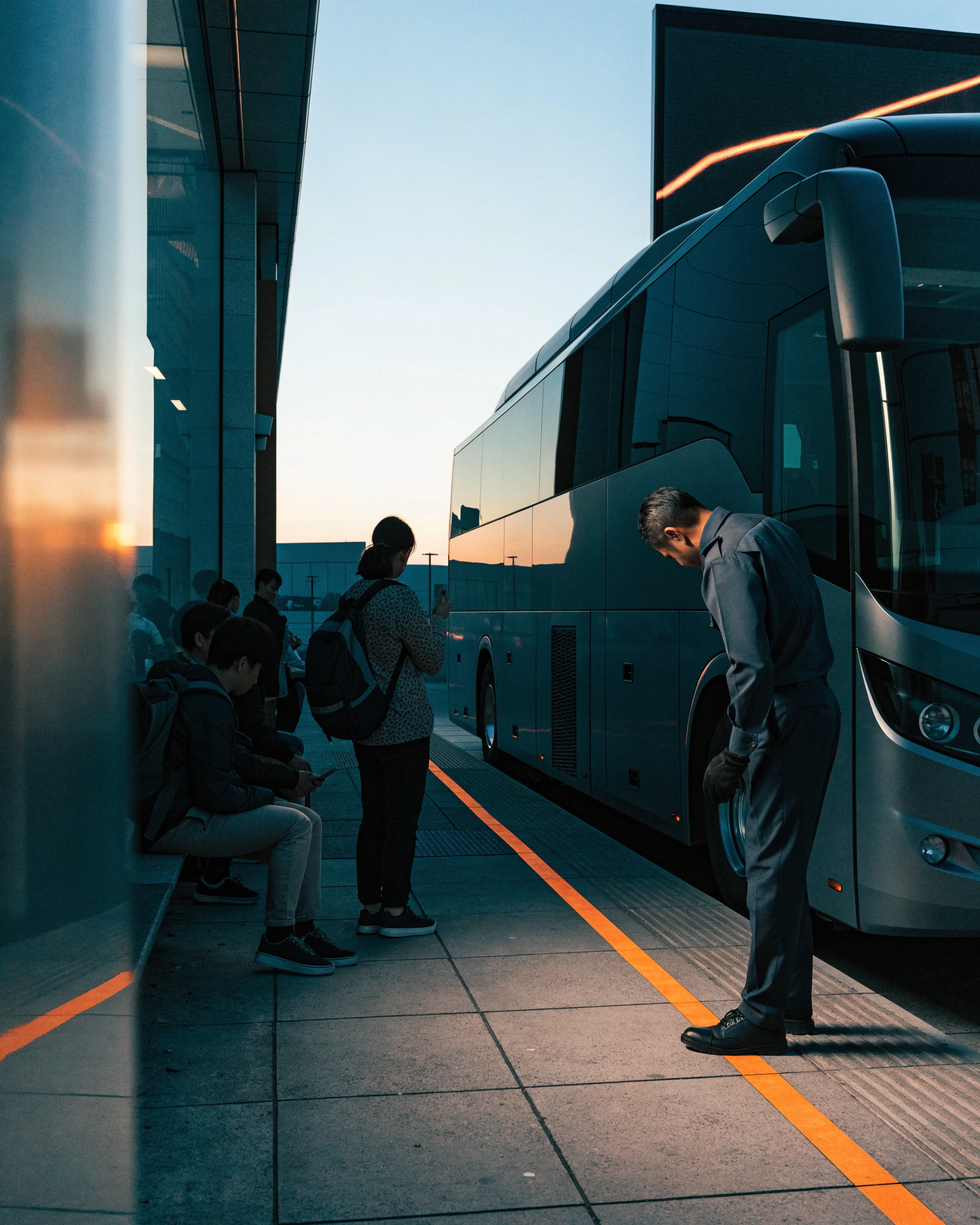 The driver checks tyres, lights, and the live route display before boarding.