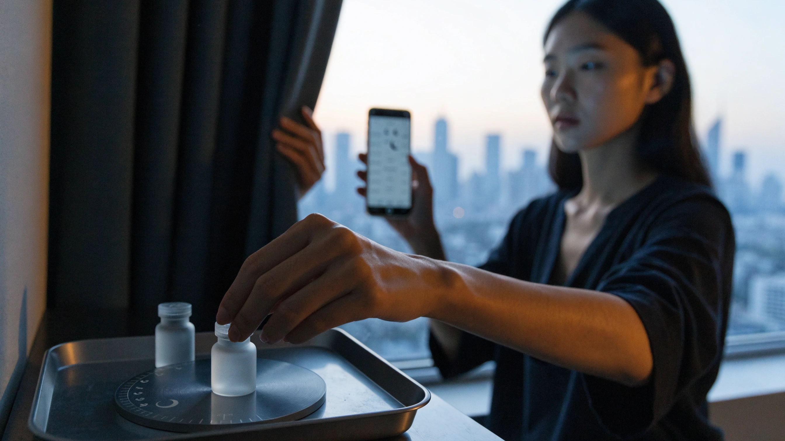 Curtains close over the destination skyline as the final vial returns to its tray.