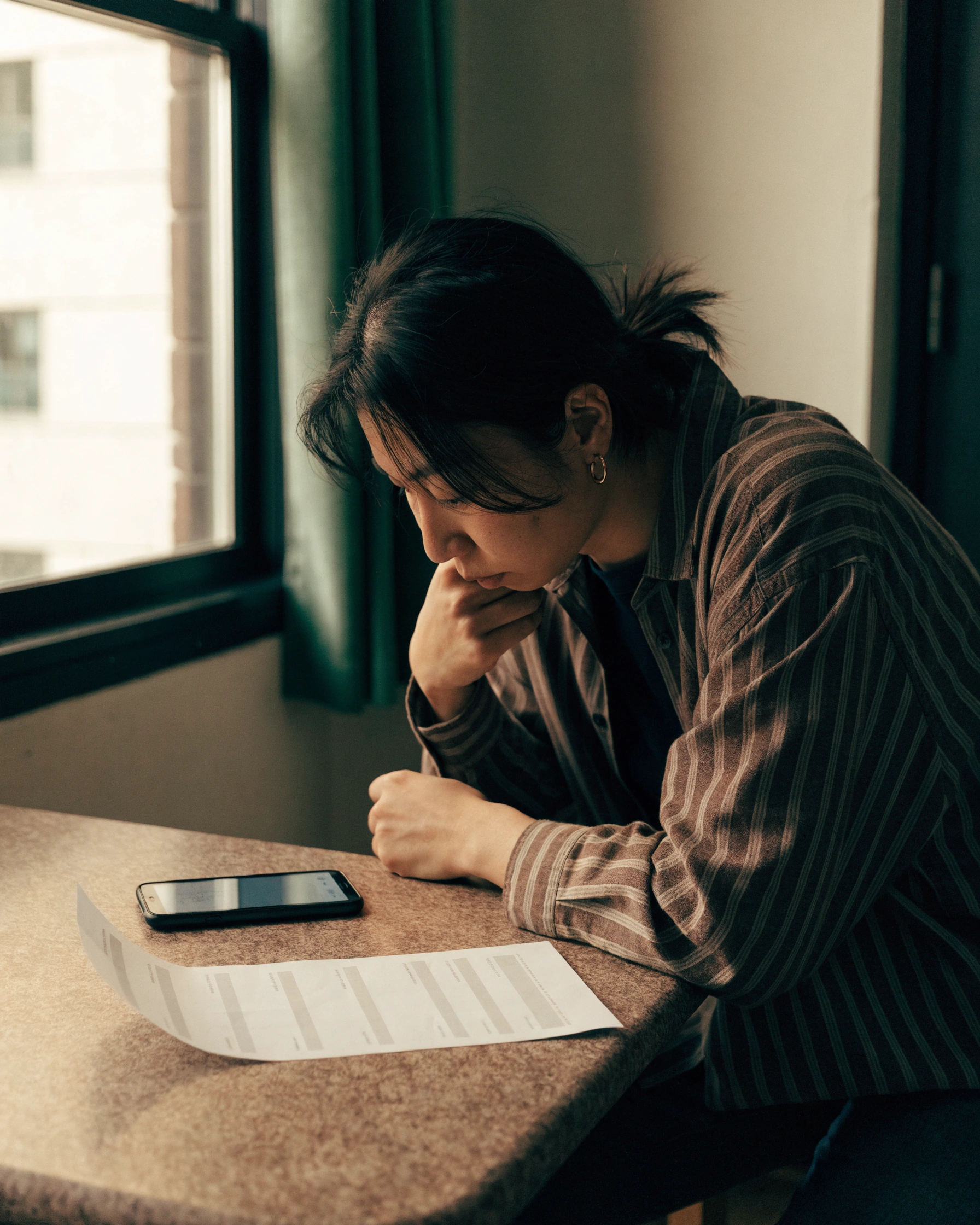 A wage deposit appears beside the worker's Canadian pay statement.